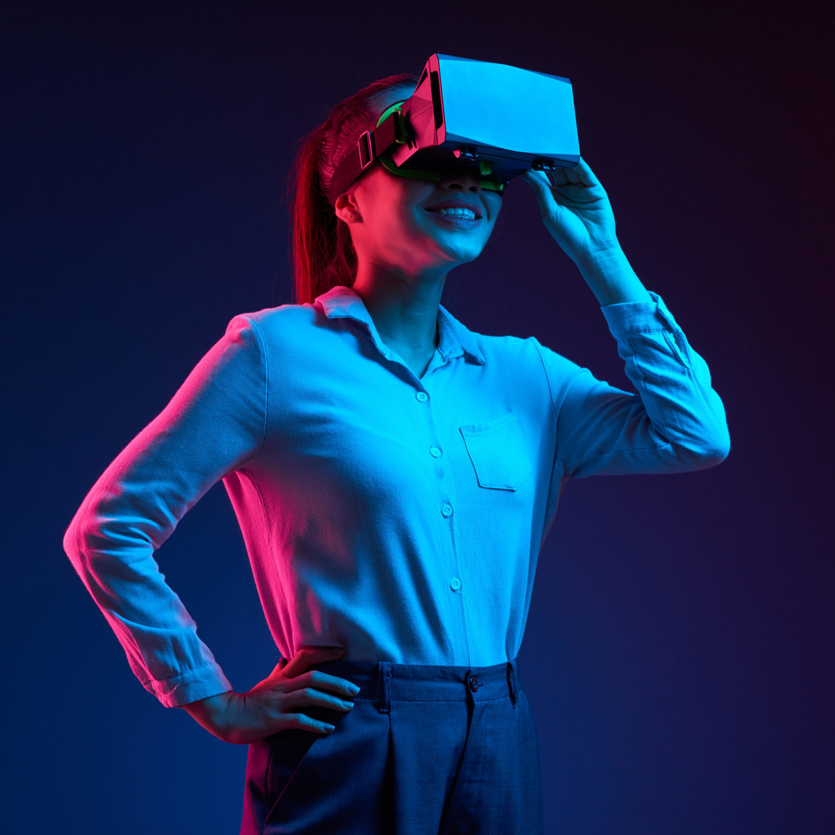 Woman using VR headset on stage